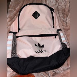 Adidas pink backpack.
